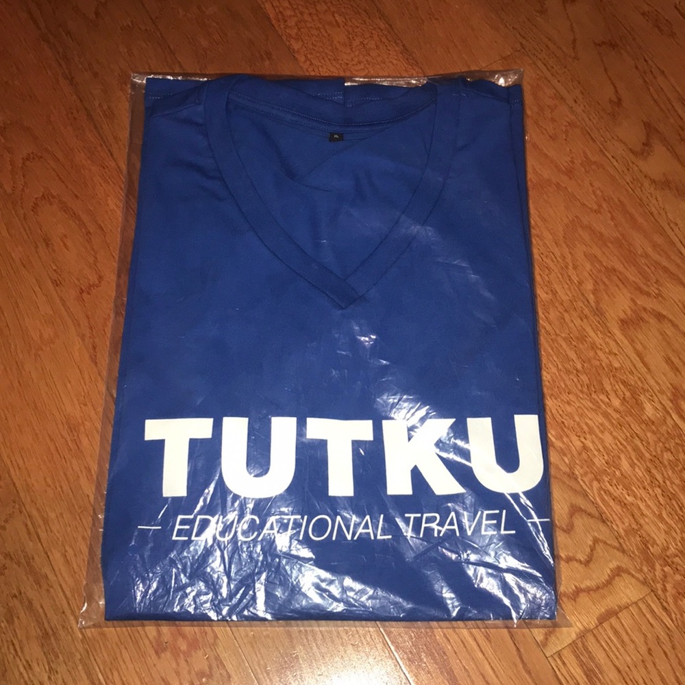 NWT Blue Tutku Educational Travel V-Neck SS Shirt